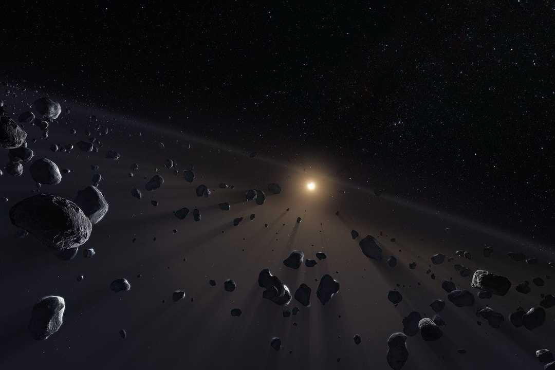 太陽系の端の惑星、海王星のさらに外側に広がる若い彗星の凍った核の想像図。