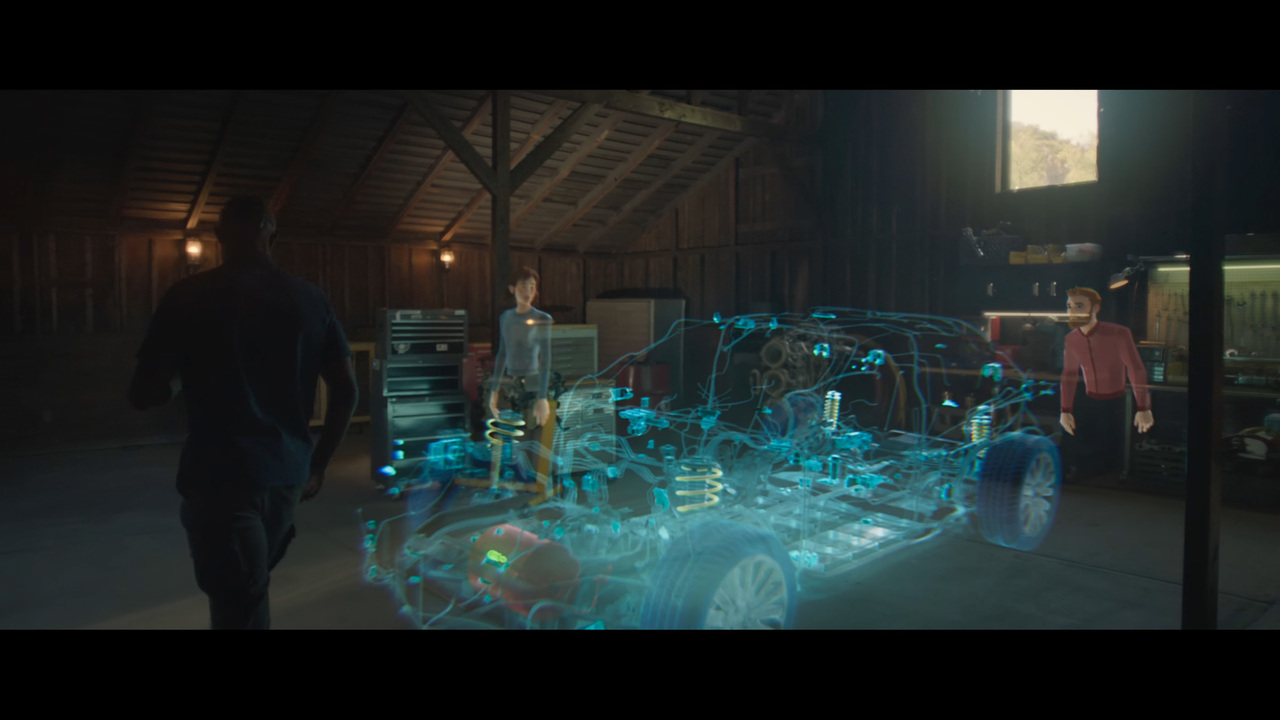 Microsoft Mesh説明ビデオより。3Dの物体を、複数の場所にいる人がネットワークを介してみながら作業している。実在する人物は左の男性のみだ。