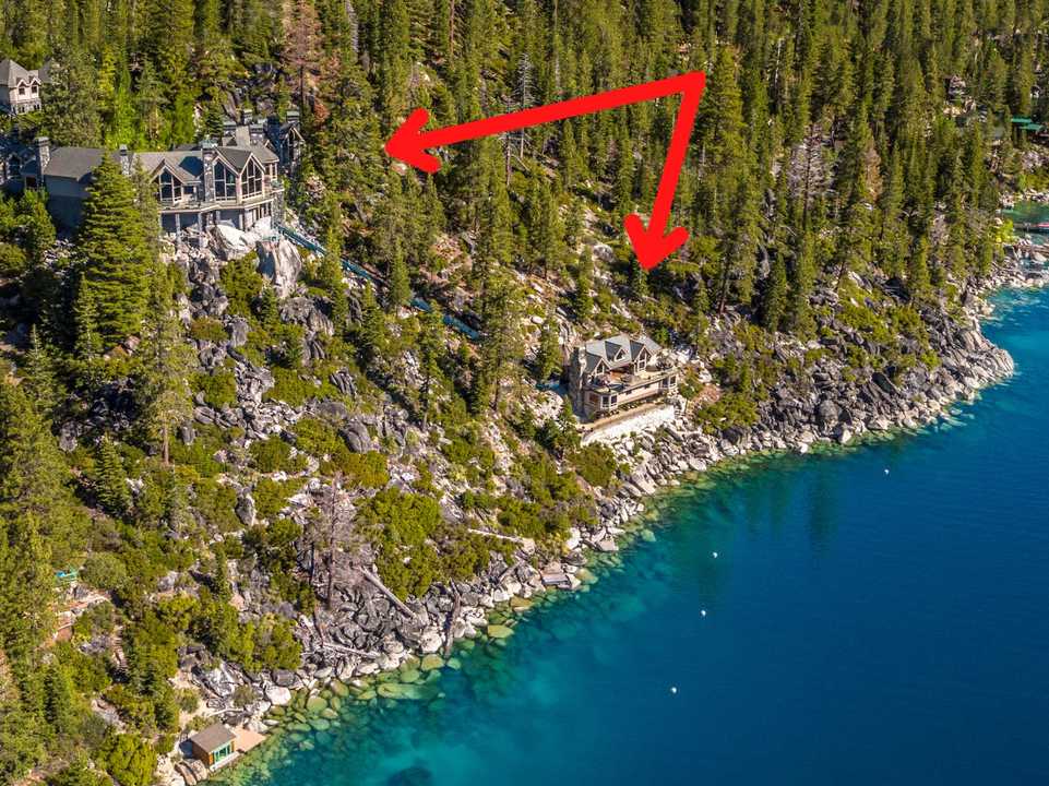 The mansion and beach house are built on a cliff by Lake Tahoe