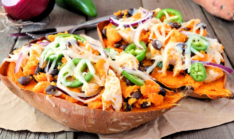 baked-stuffed-sweet-potatoes-close-up-against-royalty-free-image-842991132-1537210037